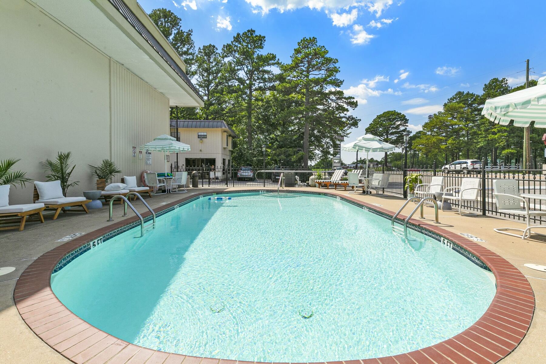 The oval pool with its red brick edge