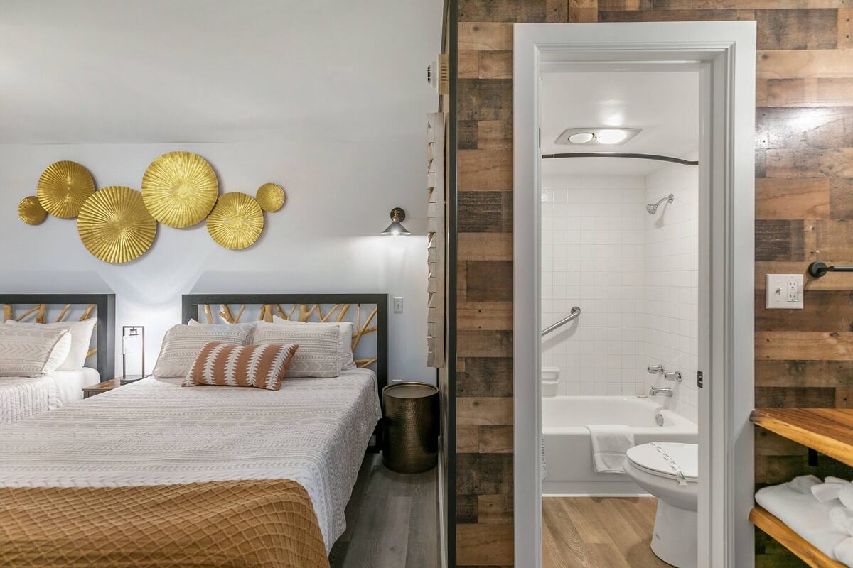Double queen room looking toward the bathroom